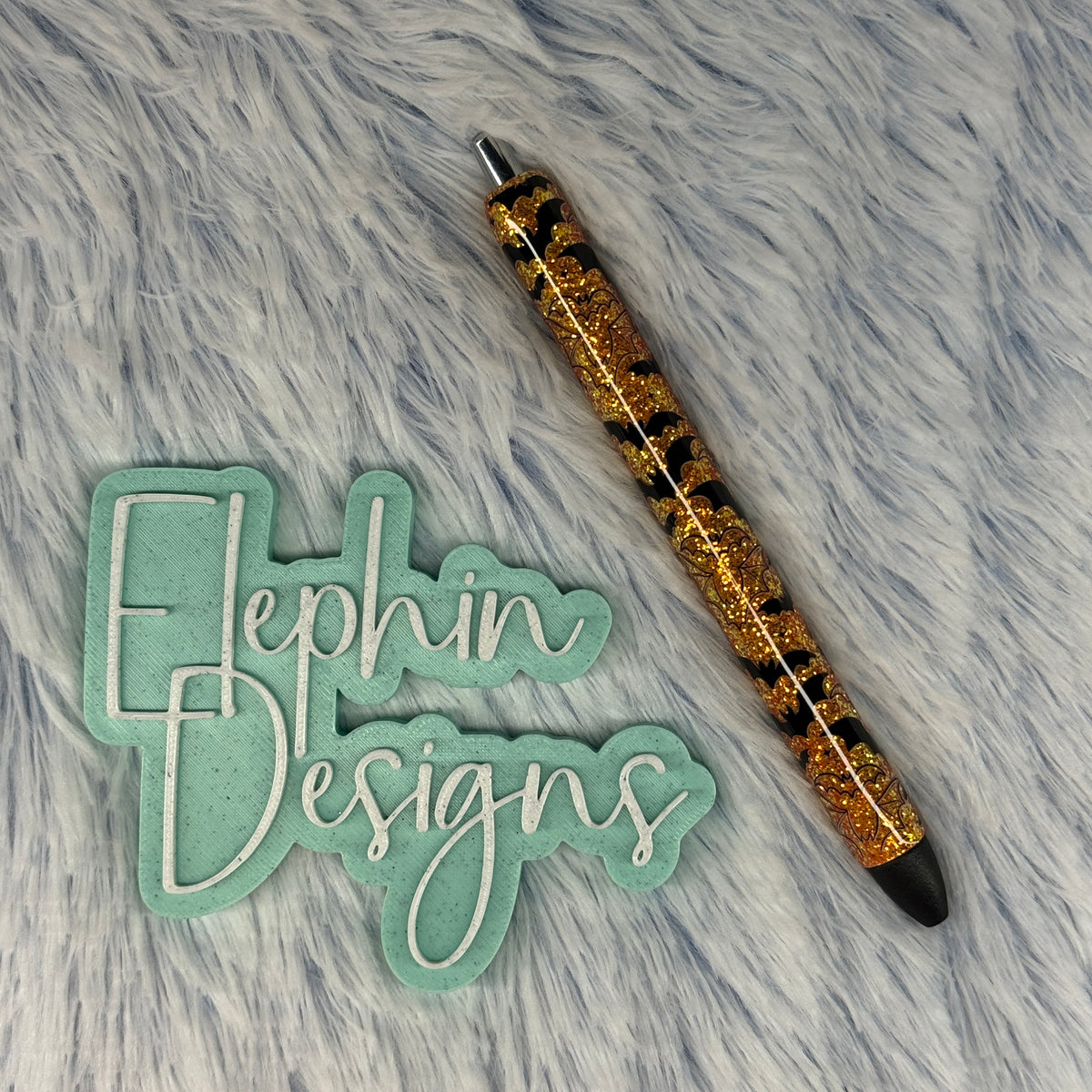 Gold glitter Halloween pen with black Halloween details and black accents